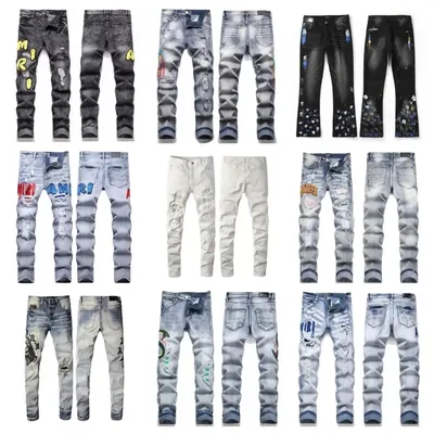 Twelve pairs of distressed jeans in three rows, in light blue, black, white and paint-spattered washes